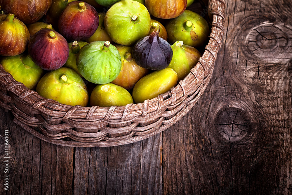 different varieties of figs in wicker basket different varieties of figs in wicker basket