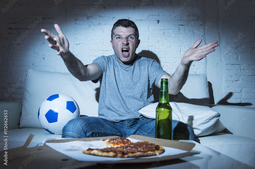Fototapeta premium angry football fan ball and beer bottle watching tv soccer screaming upset