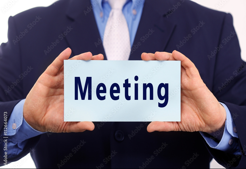 Business man hold paper meeting text on it Business man hold paper meeting text on it
