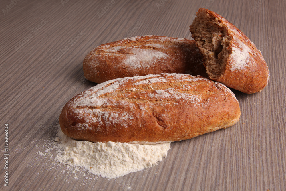 broken bread flour on gray wooden background
