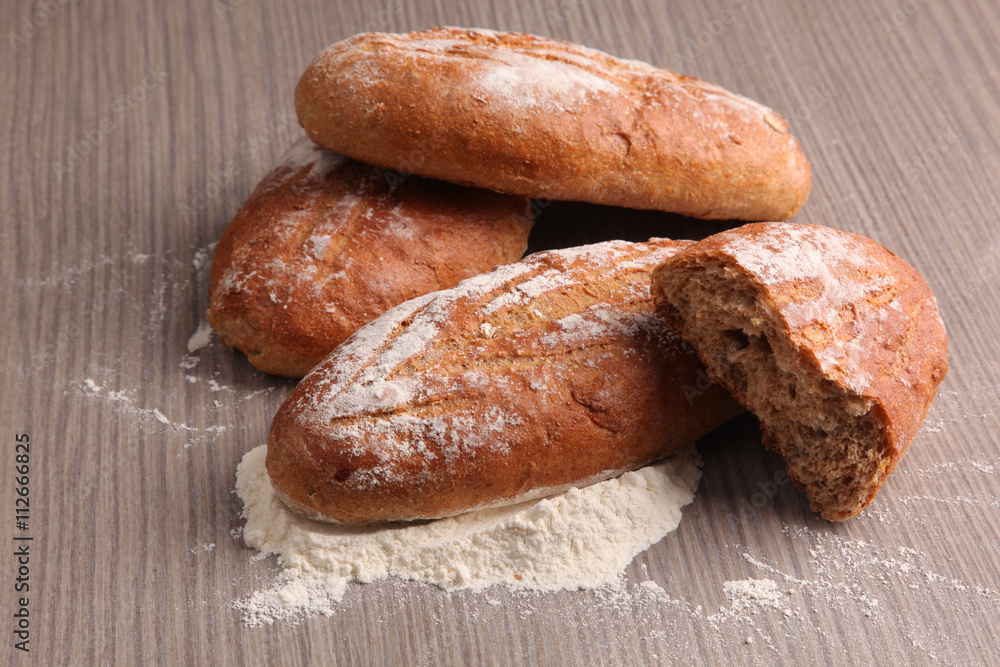 broken bread flour on gray wooden background