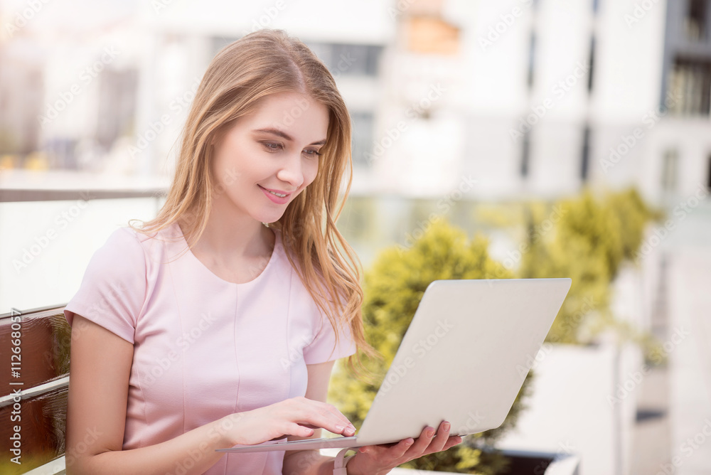 Modern young woman using technologies Modern young woman using technologies