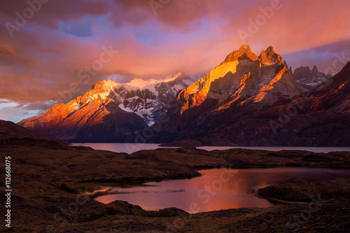 First light on the Cuernos under stormy skies
