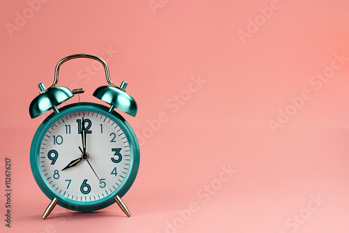 Teal retro alarm clock with copy space 