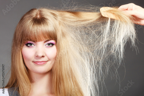 Blonde woman with her long healthy hair.