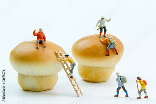 Obraz na płótnie Tiny toys climber a bread filling.Stuffed pork buns