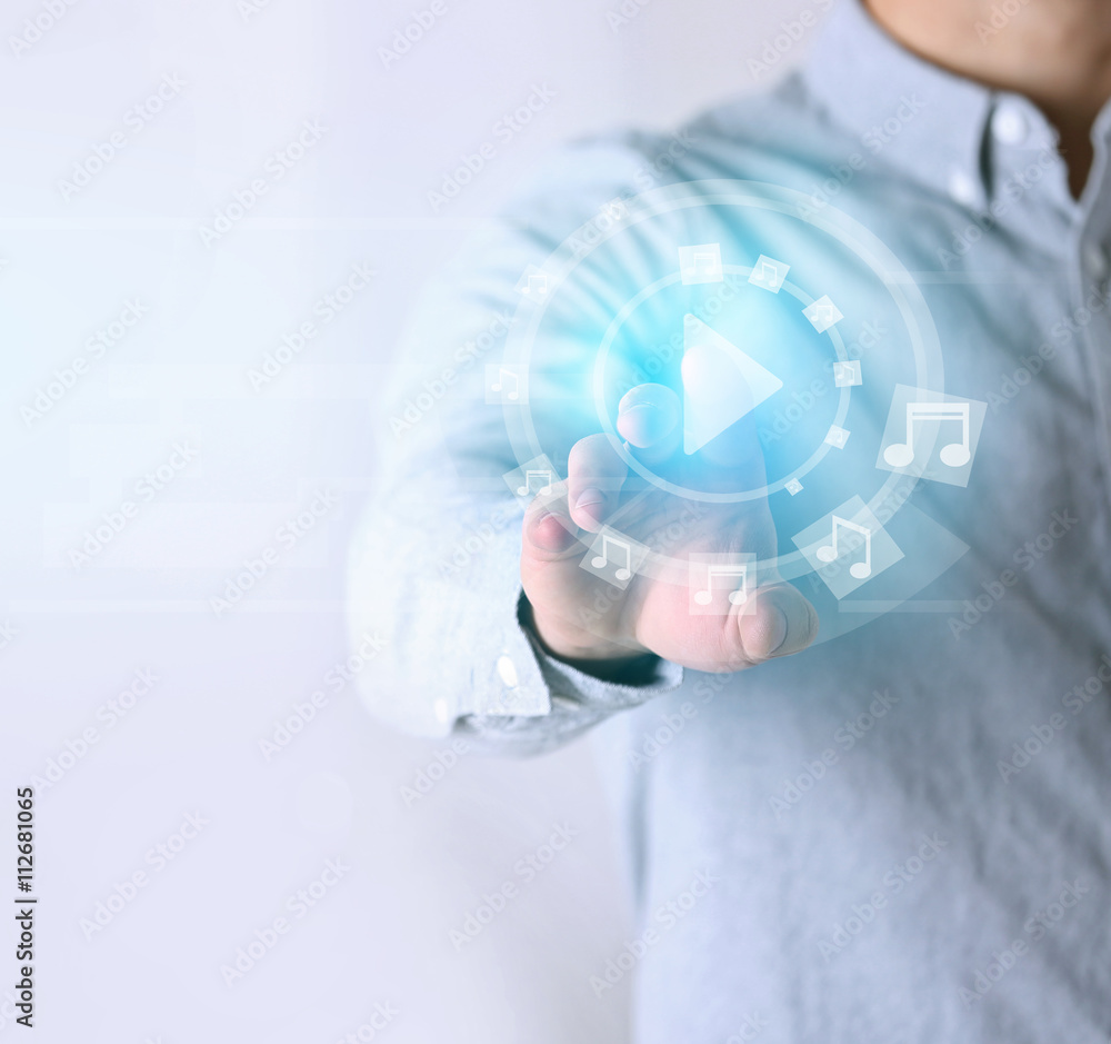 Man push play button on high tech touch screen Man push play button on high tech touch screen