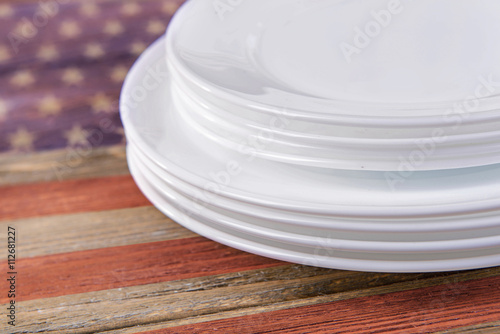 Set of white dishes on table close-up. American cuisine food concept