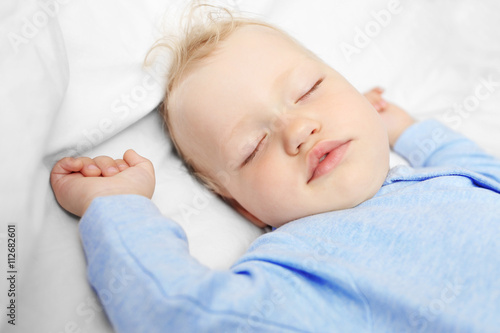 Baby sleeping on bed