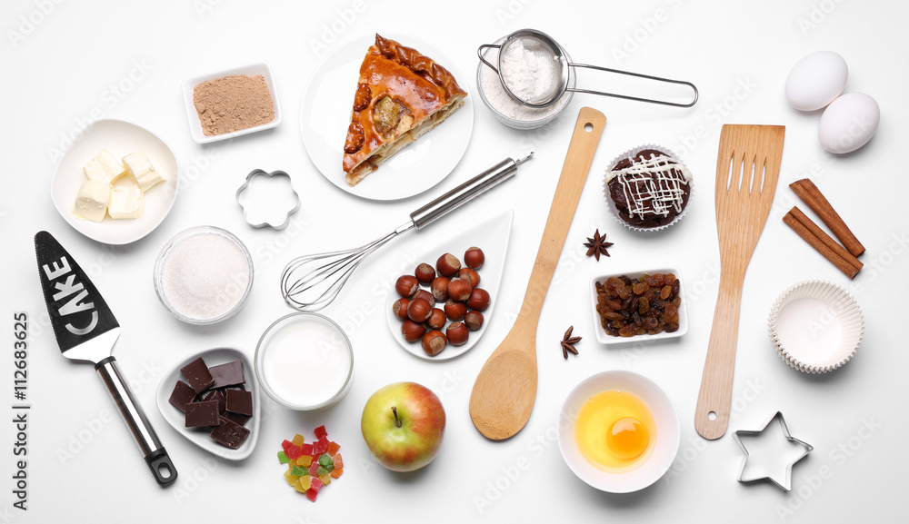 Cake ingredients on white table. Flat lay Cake ingredients on white table. Flat lay