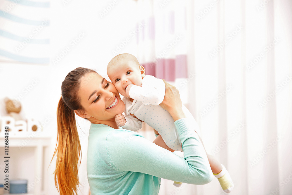 Mother and her little baby at home