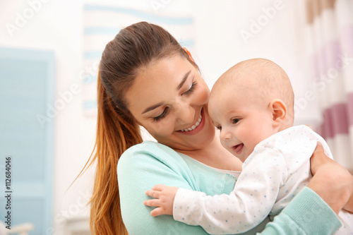 Mother and her little baby at home