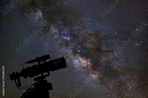 Silhouette of telescope watching the milky way galaxy on night s