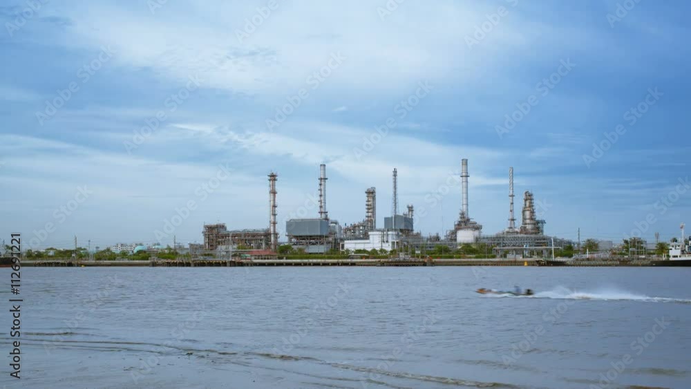 Oil Refinery or Oil Industry in front of Chao Phraya River, and sky sunset Day to night and ship transportation and factory concept High quality in 4K Timelapse Oil Refinery or Oil Industry in front of Chao Phraya River, and sky sunset Day to night and ship transportation and factory concept High quality in 4K Timelapse
