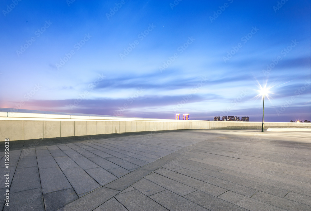 empty square with cityscape and skyline at sunrise in harbin