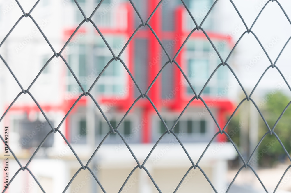 steel grate and blur of building background steel grate and blur of building background