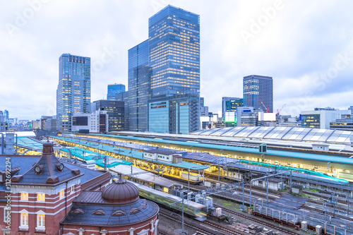 Canvas Print modern office buildings near tokyo railway station in cloud sky
