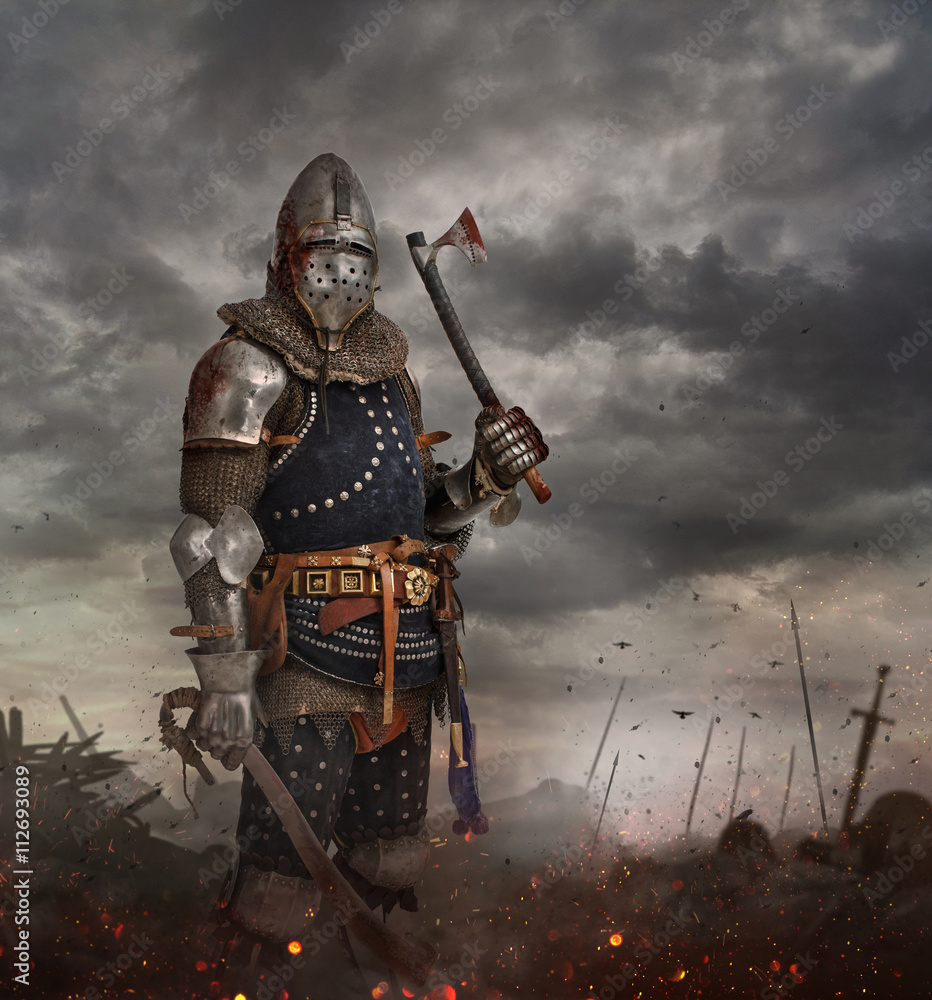 Knight with sword in battlefield. Stock Photo | Adobe Stock