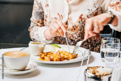 women eating waffles