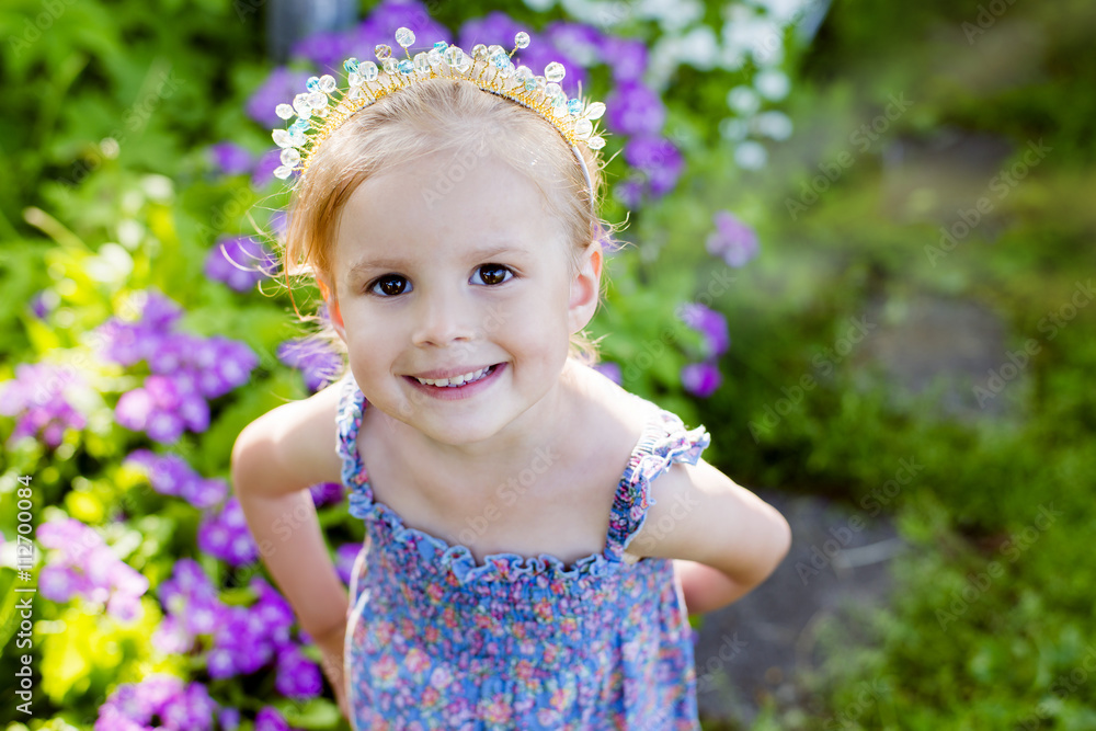 beautiful girl in a summer garden, children's holidays beautiful girl in a summer garden, children's holidays