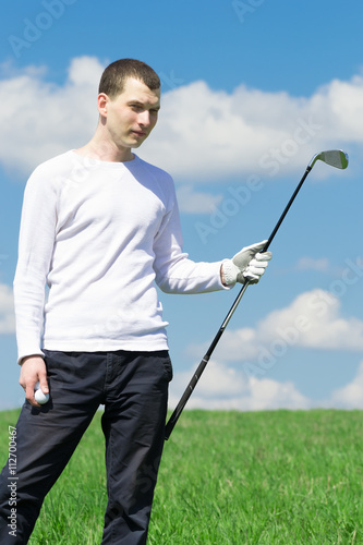 playing golf on grass