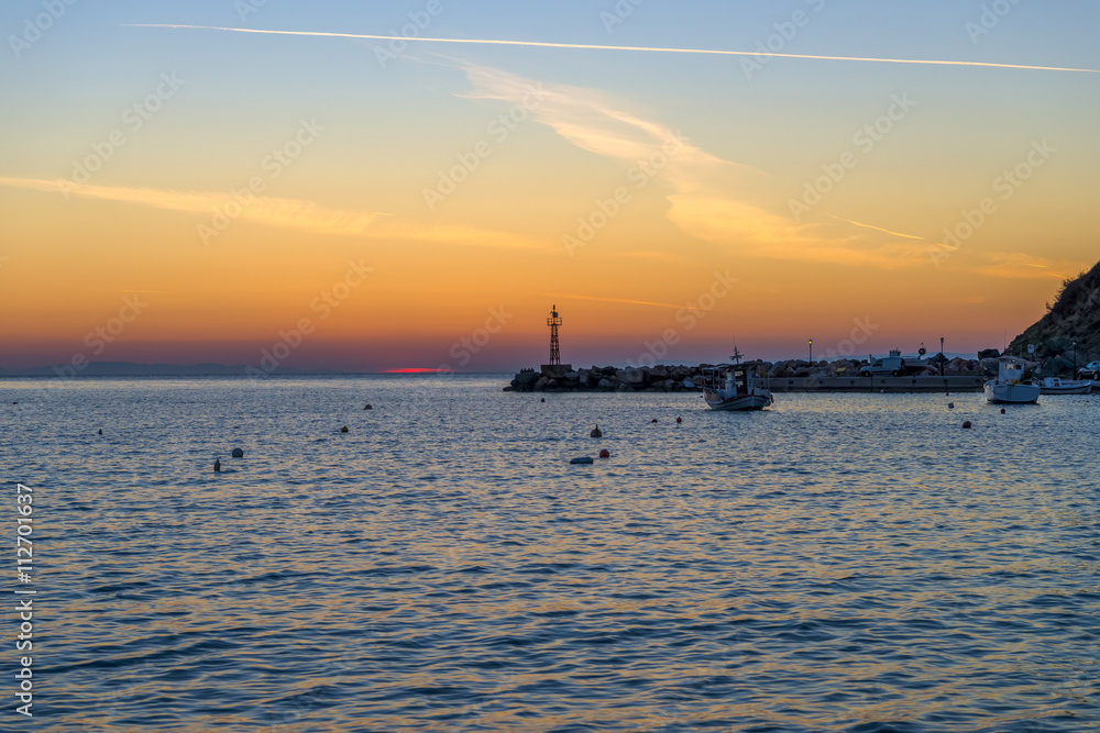 Spectacular sunset at Kini beach, Syros, Greece.