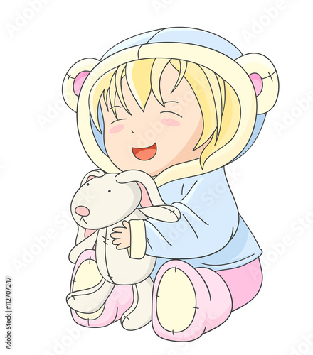 Happy little baby playing with toy rabbit