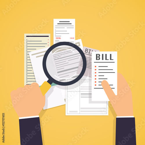 Paying bills. Hands holding bills and magnifying glass. Payment