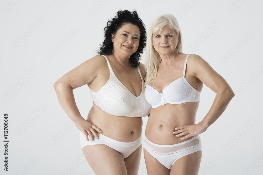 Two mature woman in underwear Photos | Adobe Stock