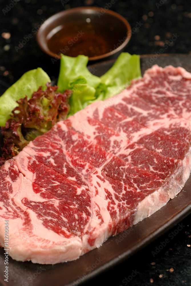 Premium raw japanese kobe beef sliced on plate