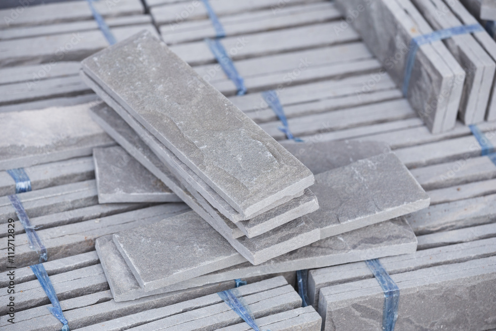 pile of gray stone tiles prepare for install
