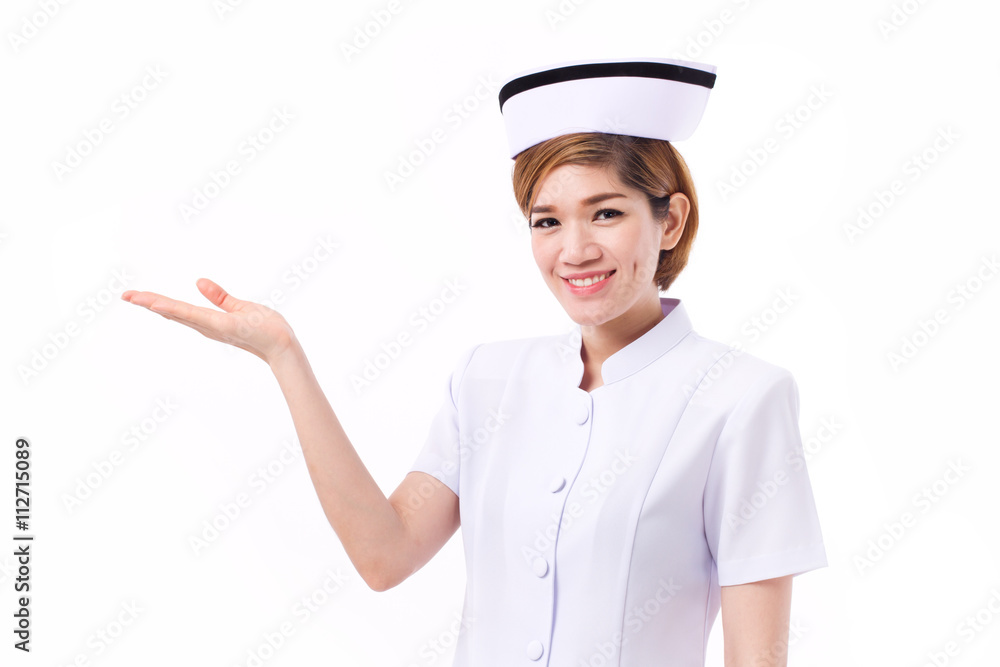 smiling female nurse presenting, showing her hand to blank space smiling female nurse presenting, showing her hand to blank space