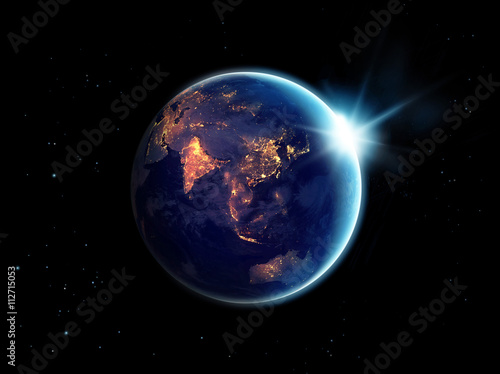 Fototapeta Naklejka Na Ścianę i Meble -  City lights at night in planet earth  with sun rising