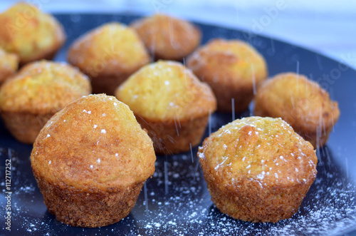Icing sugar on mini muffins