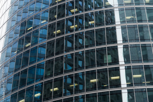 Skyscrapers with glass facade. Modern buildings in Paris business district. Concepts of economics, financial, future.  Copy space for text. Dynamic composition.