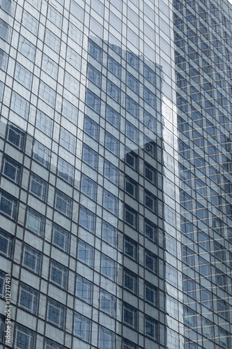 Skyscrapers with glass facade. Modern buildings in Paris business district. Concepts of economics, financial, future. Copy space for text. Dynamic composition.