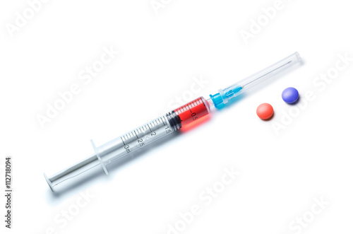 Syringe and Pills Isolated on White