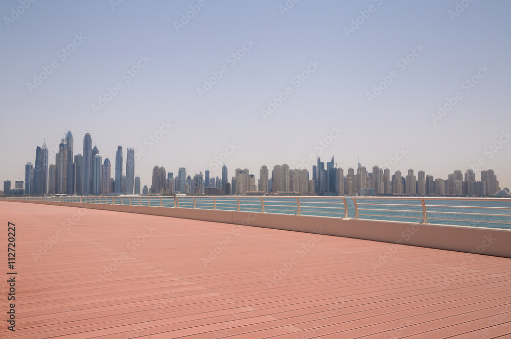 view on cityscape of Dubai from pier on Palm Jumeirah