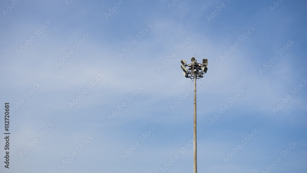 Street spotlight pole for sport stadium with blue sky background Street spotlight pole for sport stadium with blue sky background