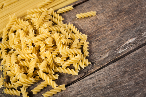 Mixed pasta . On a wooden background. Top view