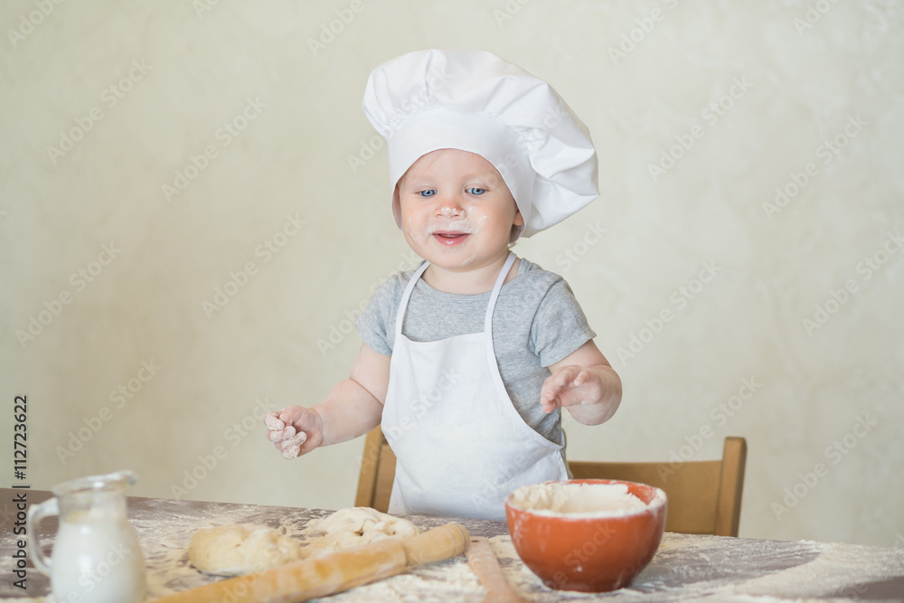The little boy in a suit of the cook The little boy in a suit of the cook