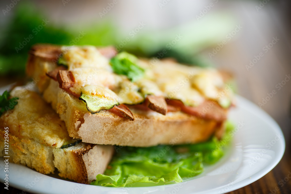 toast baked with sausage, cheese and cucumber