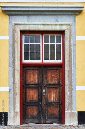 Old decayed, dried out, double door of raw oak wood, in one of the storehouses around Kronborg Castle in Elsinore, Denmark