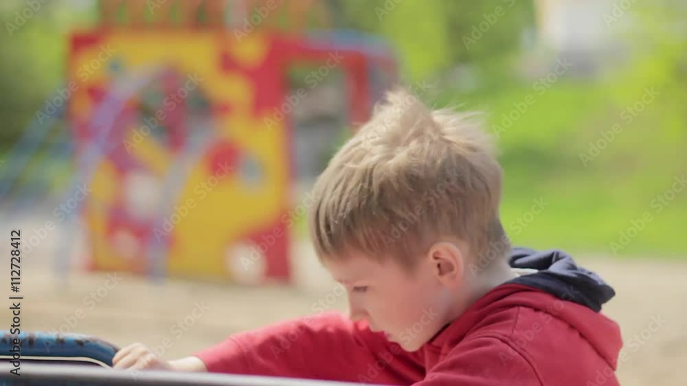 Boy on merry-go-round in park. Carousel Boy on merry-go-round in park. Carousel