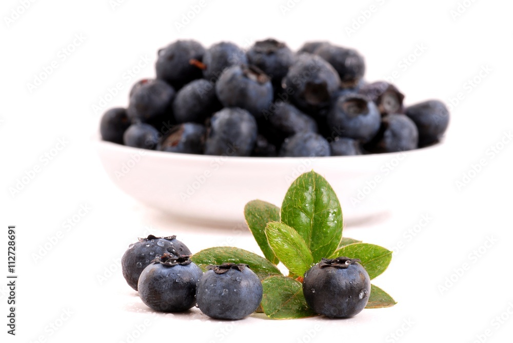 Blueberries isolated on white background. Blueberries in bowl. Blueberries isolated on white background. Blueberries in bowl.