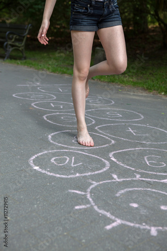 hopscotch, Young girl playing hopscotch 