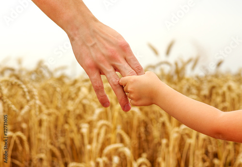 hands of child and father