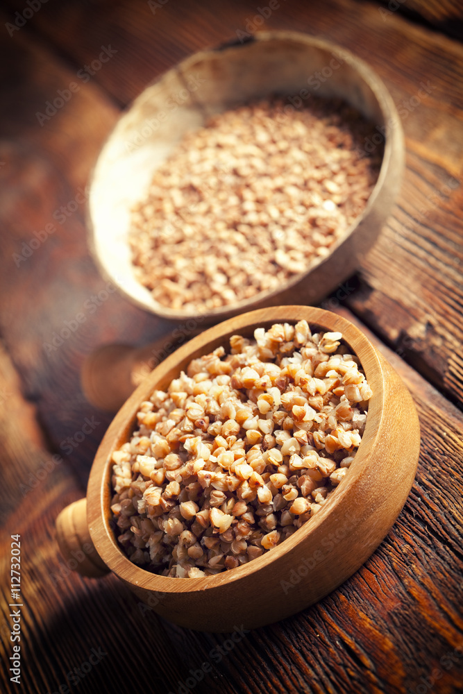 Buckwheat in wooden bowl Buckwheat in wooden bowl