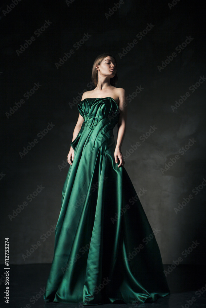 Model posing in green fashion dress Model posing in green fashion dress
