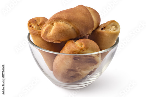 Fresh bavarian pastries rolls, kifla kiflice, in the glass bowl, isolated on white background photo